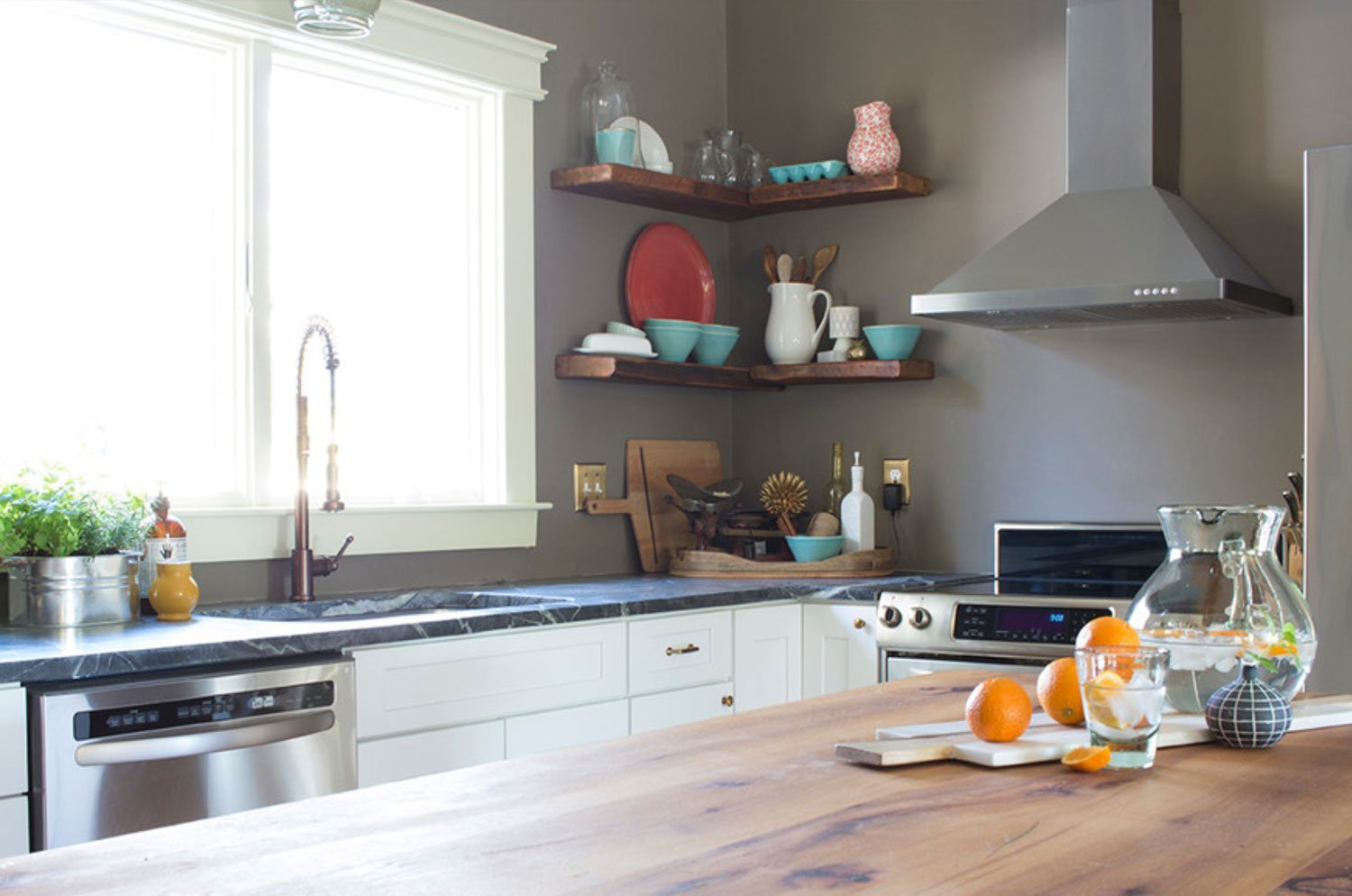 Styled floating corner shelves in the kitchen.