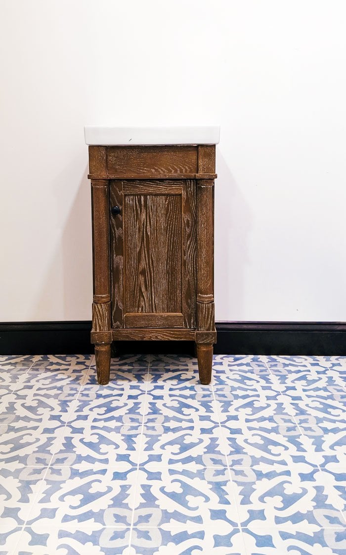 Gorgeous feiminie, cement look tile, classic tiny vanity.