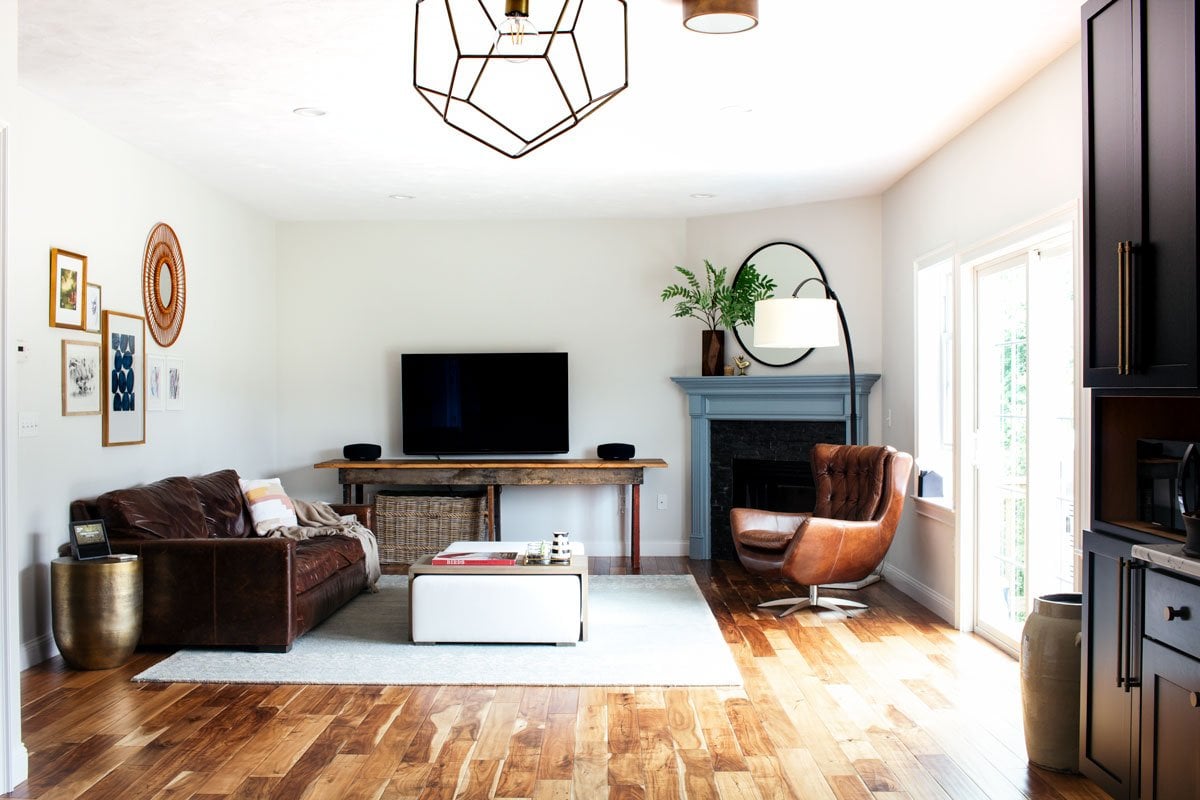 Shop my eclectic transitional living room | Leather couch, brass side table, swivel chair