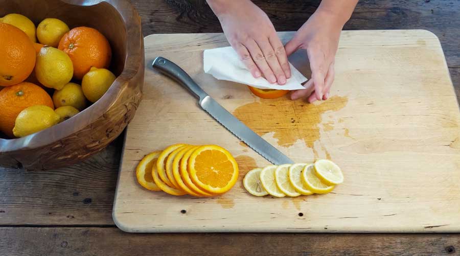 Blot oranges with a paper towel tp remove excess moisture