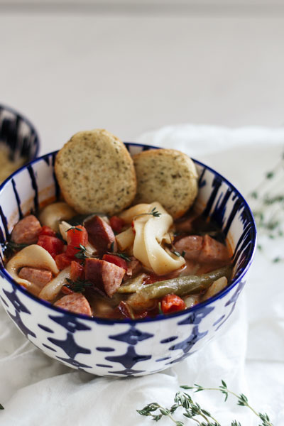 This easy kielbasa vegetable soup recipe is perfect for winter. With only 5 ingredients it’s simple to make and takes only 5 minutes in the Instant Pot (stovetop instructions included as well). This hearty dump and go soup is comforting and budget-friendly. You could even make it in the crockpot!