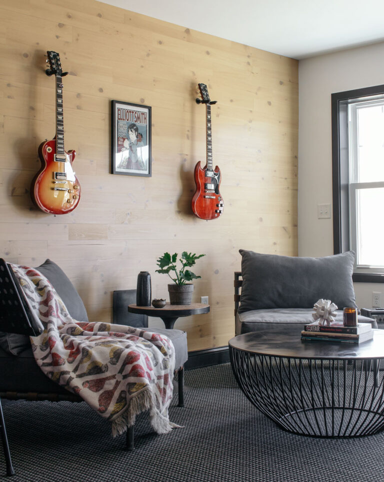 Music room with reclaimed wood wall with guitars hanging