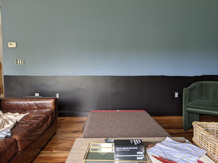 black and blue wall with leather couch