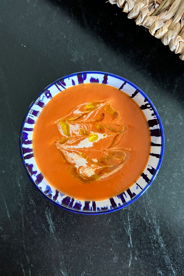 Homemade tomato soup with cream and olive oil.